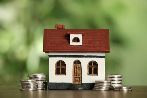 Mortgage Concept House Model Coins Wooden Table Blurred Background Closeup — 스톡 사진
