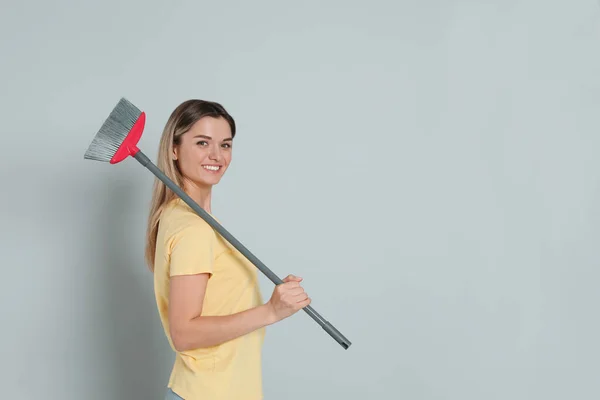 Young Woman Broom Grey Background Space Text — Stock Fotó