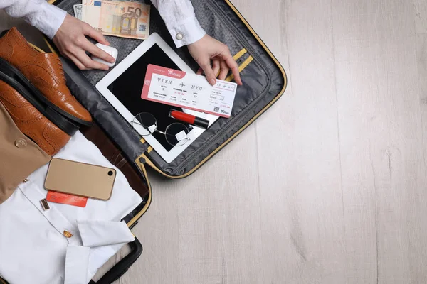 Woman Packing Suitcase Business Trip Wooden Floor Top View — Stock fotografie