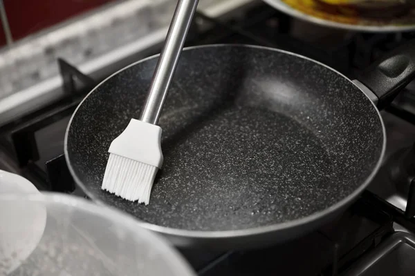 Greasing Frying Pan Stove Kitchen Closeup — Stockfoto