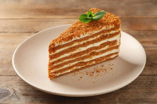 Slice Delicious Layered Honey Cake Mint Wooden Table — стоковое фото