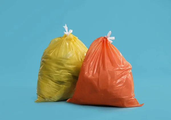 Trash Bags Full Garbage Light Blue Background — Fotografia de Stock