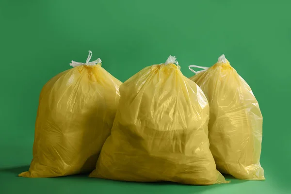 Trash Bags Full Garbage Green Background — Fotografia de Stock