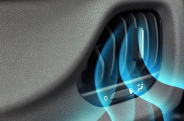 Closeup view of conditioning system in car and illustration of cool air flow