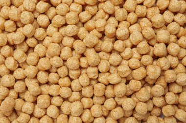 Tatlı gevrek mısır topları arka planda, üst manzara