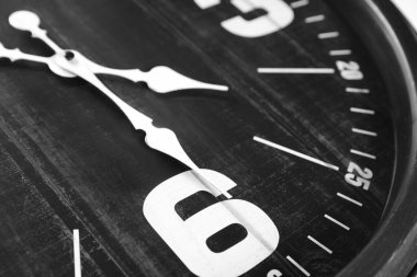 Closeup view of black stylish analog clock