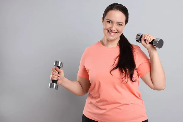 Happy Overweight Woman Doing Exercise Dumbbells Grey Background Space Text — Stock Photo, Image