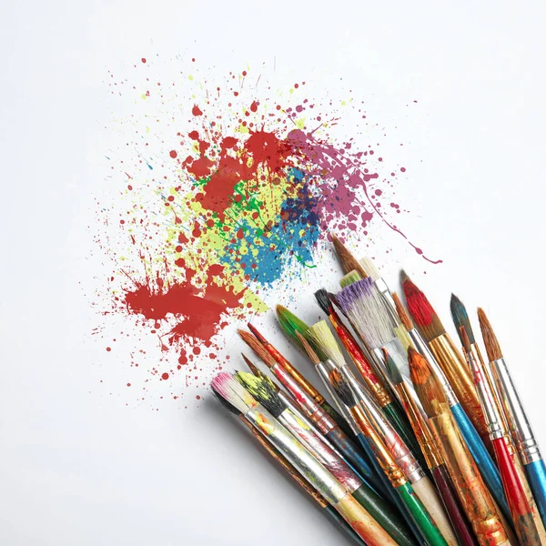 Different Brushes Paint Splatters White Background Top View — Stock Fotó