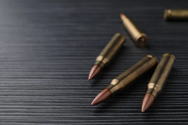 Many Bullets Black Wooden Table Closeup Space Text — Stockfoto