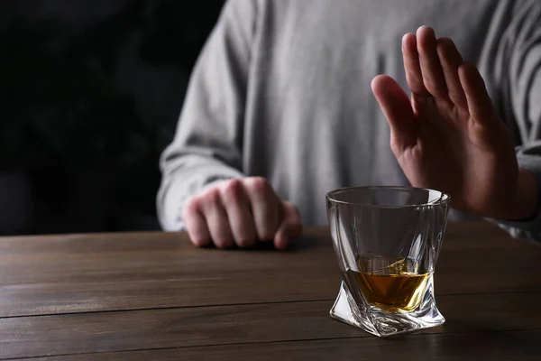 Man Refusing Drink Whiskey Wooden Table Closeup Alcohol Addiction — Stockfoto