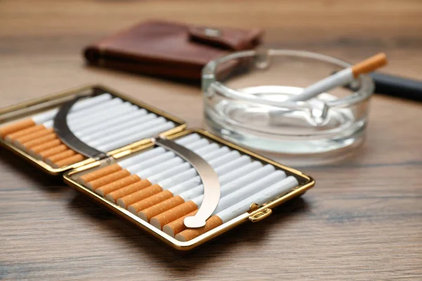 Open Case Tobacco Filter Cigarettes Glass Ashtray Wooden Table Closeup — Foto de Stock