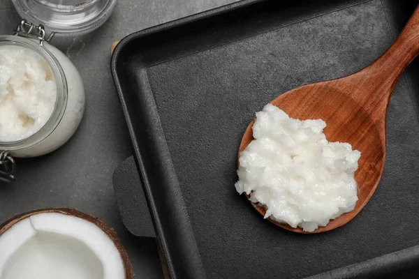 Baking Dish Coconut Oil Wooden Spoon Grey Table Flat Lay — Stockfoto