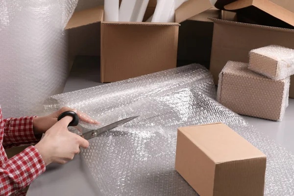 Woman Cutting Bubble Wrap Table Warehouse Closeup — Stock Photo, Image