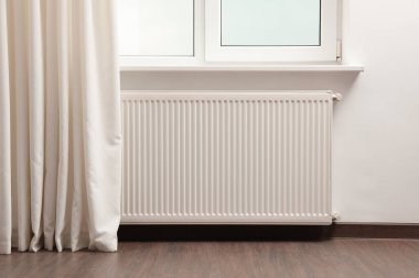 Modern radiator at home. Central heating system