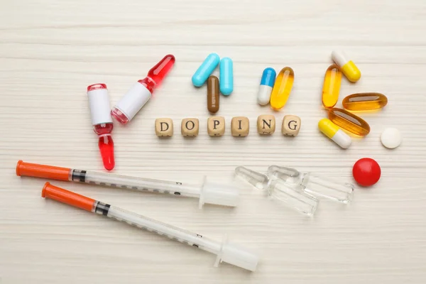 Composição Leigos Planos Com Palavra Doping Drogas Mesa Madeira Branca — Fotografia de Stock