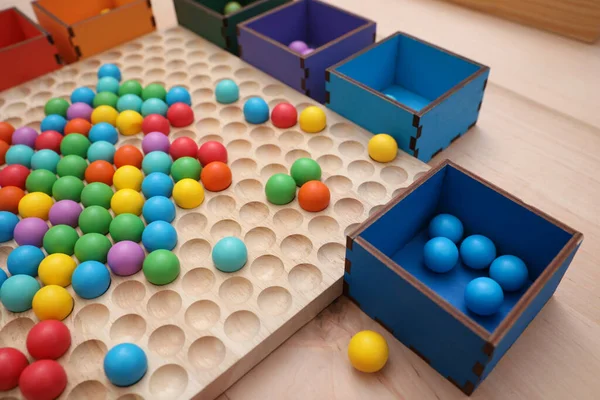Wooden Sorting Board Boxes Colorful Balls Table Closeup Montessori Toy — Zdjęcie stockowe