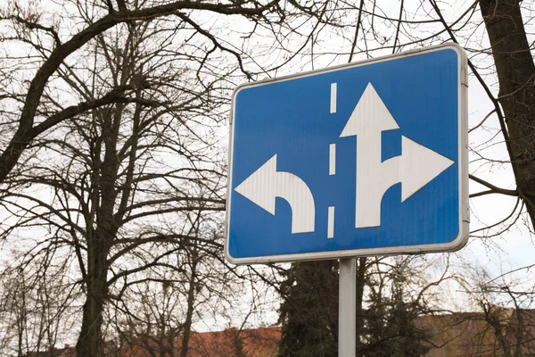 Traffic sign Road Direction outdoors on sunny day