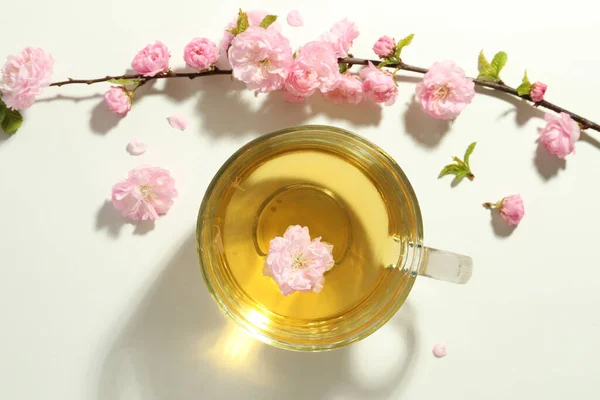 Glass Cup Freshly Brewed Tea Beautiful Flowers Light Table Flat — Stockfoto