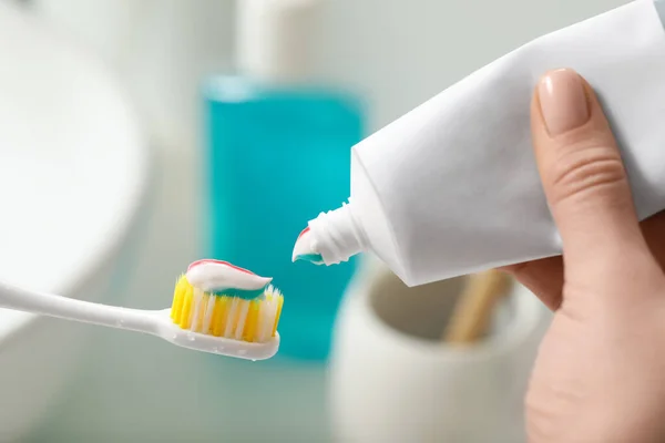 Woman Applying Toothpaste Brush Blurred Background Closeup — Stock Photo, Image