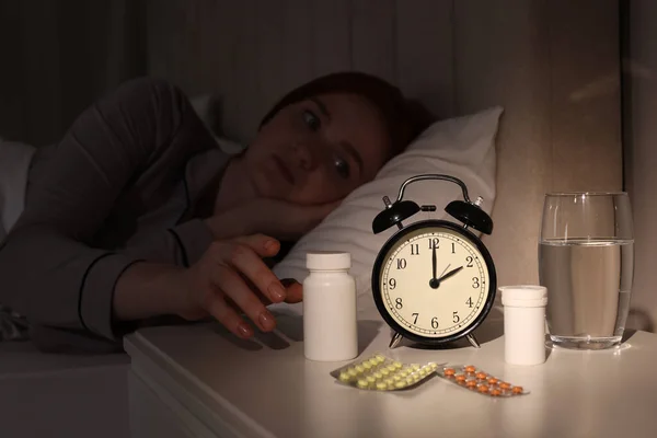 Young Woman Suffering Insomnia Taking Pill Bottle Bed Night Focus — Zdjęcie stockowe