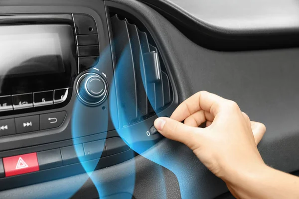 Woman turn on conditioner in car and illustration of cool air flow, closeup