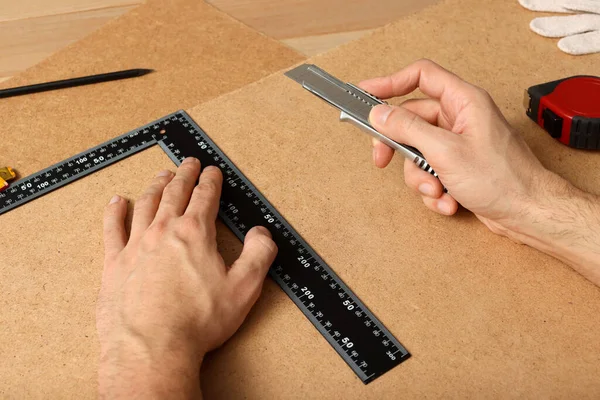 Man Cutting Chip Board Utility Knife Ruler Closeup — Foto Stock