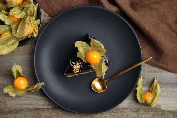 Piece Tasty Cake Decorated Physalis Fruit Wooden Table Flat Lay — Stock Fotó