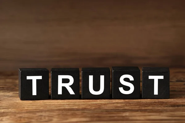 Black Cubes Word Trust Wooden Table Space Text — Fotografia de Stock