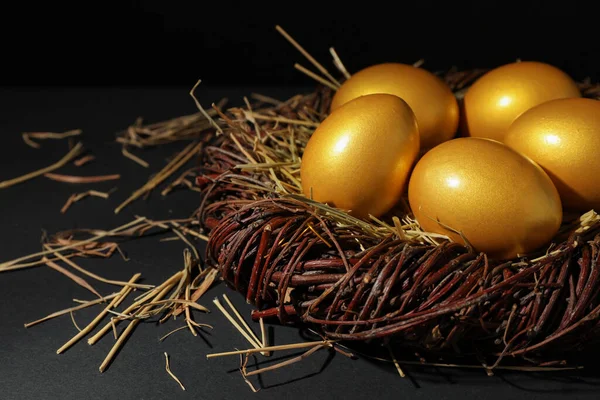 Shiny Golden Eggs Nest Black Background Space Text — Stockfoto