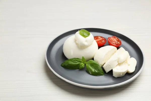 Delicious Burrata Cheese Basil Cut Tomato White Wooden Table — Zdjęcie stockowe