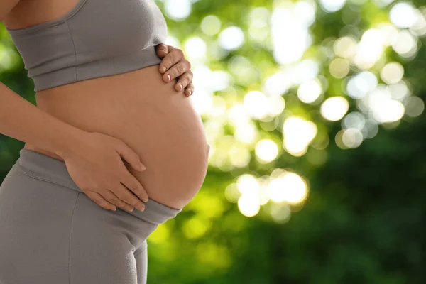 Young Pregnant Woman Touching Her Belly Outdoors Closeup Space Text — Φωτογραφία Αρχείου