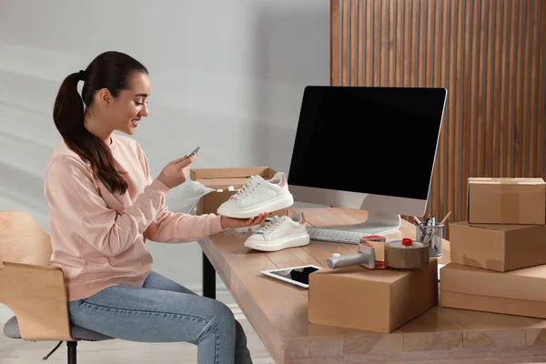Shoes Seller Taking Picture Sneakers Table Office Online Store — Stockfoto