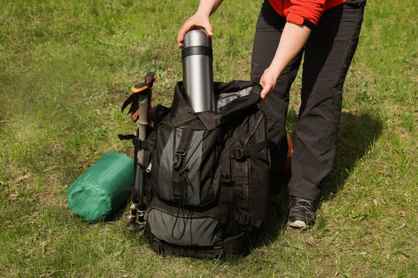 Hiker Putting Thermos Backpack Outdoors Closeup — Foto de Stock
