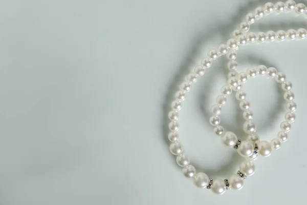 Elegant Pearl Necklace Bracelet White Table Top View Space Text — Stok fotoğraf