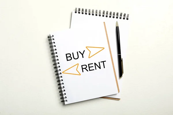 Buy Rent Choice Concept Notebooks Pen White Background Flat Lay — Stockfoto