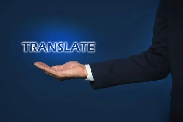 Man Showing Virtual Model Word Translate Dark Blue Background Closeup — Stock Photo, Image