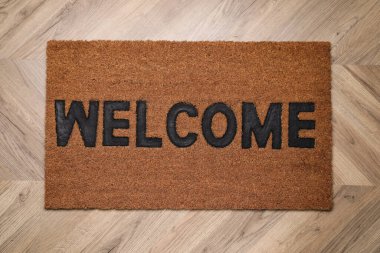 Kelime ile şık kapı paspası Ahşap zemin, üst manzara