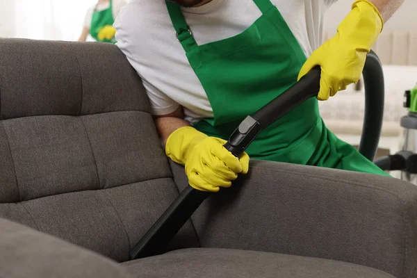 Professional Janitor Vacuuming Armchair Room Closeup — Zdjęcie stockowe