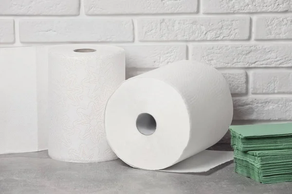 Different Paper Towels Napkins Grey Table White Brick Wall — Φωτογραφία Αρχείου