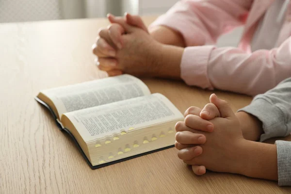 Boy His Godparent Praying Together Wooden Table Indoors Closeup —  Fotos de Stock