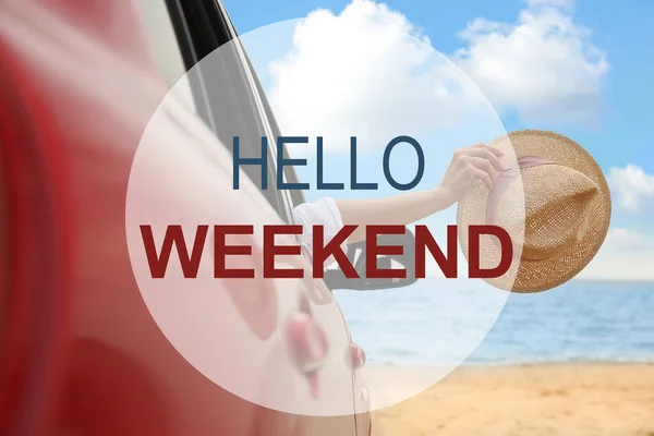 Hello Weekend. Woman waving from car on beach, closeup