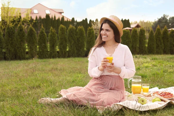 Young Woman Glass Juice Having Picnic Outdoors Summer Day — Stock Fotó