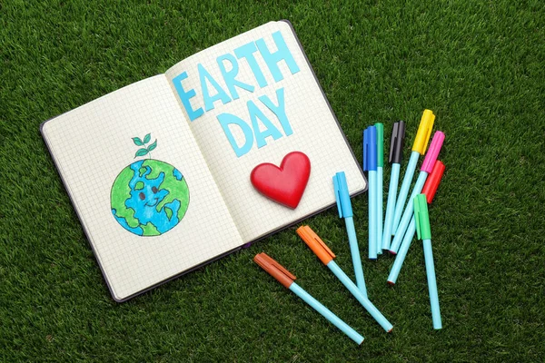 Notebook Words Earth Day Planet Drawing Markers Green Grass Flat — Stok fotoğraf