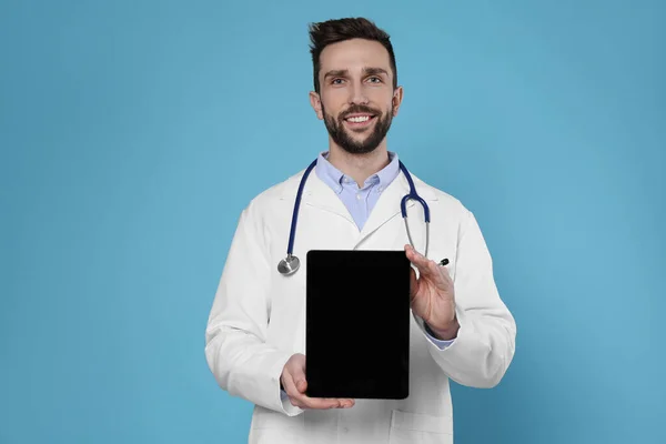 Doctor Stethoscope Holding Blank Tablet Light Blue Background Space Design — Stok fotoğraf