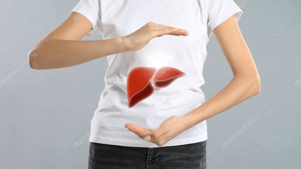 Woman and illustration of liver on light grey background, closeup