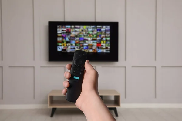 Woman Remote Control Changing Channels While Watching Home Closeup — Stockfoto