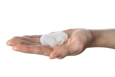 Woman holding anti-snoring device for nose on white background, closeup