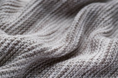 Arka plan olarak güzel gri örülmüş kumaş, yakın plan