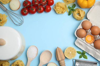 Frame made of cooking utensils and fresh ingredients on light blue background, flat lay. Space for text clipart