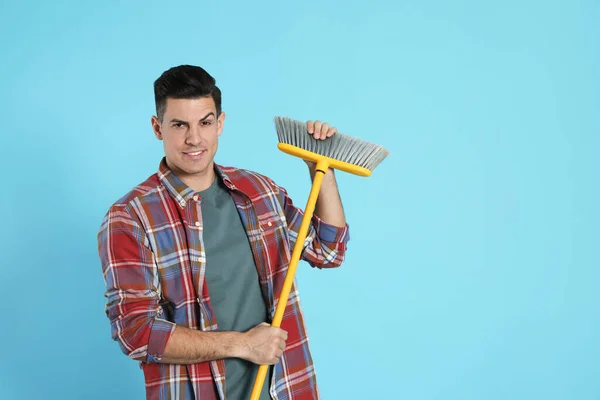 Man Yellow Broom Light Blue Background Space Text — Foto Stock